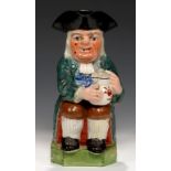 A STAFFORDSHIRE EARTHENWARE TOBY JUG, C1830-40 in green coat with warty face, 24cm h++