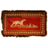 A VICTORIAN PICTORIAL RED GROUND WOOLWORK RUG OF A DOG AND PARTRIDGES, MID 19TH C in ribbon