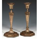 A PAIR OF SHEFFIELD PLATE NEO CLASSICAL STYLE FLUTED CANDLESTICKS, C1780 29cm h++Slight wear and