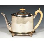 A GEORGE III OVAL SILVER TEAPOT AND STAND the teapot with integral hinge, crested, 8cm h, by John