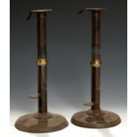 A PAIR OF GEORGE III SHEET IRON AND BRASS MOUNTED 'HOG SCRAPPER' CANDLESTICKS, C1800 with sliding