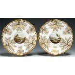 A PAIR OF SPODE GADROONED DESSERT PLATES IN WORCESTER STYLE, C1820 with painted landscape and