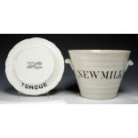 A WHITE EARTHENWARE NEW MILK PAIL AND TONGUE STAND, EARLY 20TH C pail 21cm h, Dudley & Co Ltd