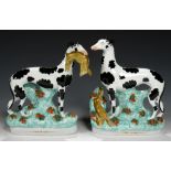 A PAIR OF STAFFORDSHIRE EARTHENWARE MODELS OF GREYHOUNDS, C1850 27 and 28cm h++First -