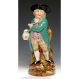 A STAFFORDSHIRE HEARTY GOOD FELLOW TOBY JUG, C1830 in turquoise coat, 29cm h++Hairline crack in