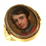 AN ENGLISH GOLD SWIVEL RING, C1840 set with portrait miniatures of an officer and young woman,