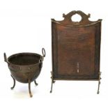 AN ARTS AND CRAFTS COPPER FIRESCREEN AND A COPPER CAULDRON ON THREE LEGS, INCLUDING LINER (2)