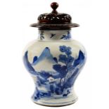 A CHINESE BLUE AND WHITE JAR, QING DYNASTY, KANGXI PERIOD, PAINTED IN BRIGHT BLUE WITH A MOUNTAINOUS