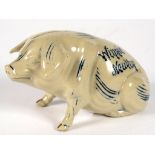 A DENBY SGRAFFITO STONEWARE PIG BANK, POSSIBLY DECORATED BY HORACE ELLIOTT, INCISED IN COBALT THE