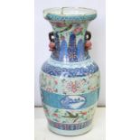 A CHINESE CANTON FAMILLE ROSE CELADON GROUND VASE, PAINTED WITH BLUE AND WHITE LANDSCAPE