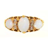 AN OPAL AND DIAMOND 3 STONE RING IN GOLD, UNMARKED. THE CABOCHON OPALS APPROX 1CT, DIAMONDS APPROX