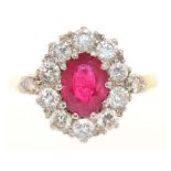 A RUBY AND DIAMOND RING IN GOLD MARKED 18CT, THE OVAL FACETED RUBY APPROX 1 CT, DIAMONDS APPROX 0.