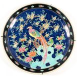 A JAPANESE PORCELAIN PLAQUE, ENAMELLED WITH BIRDS IN BRANCHES, 45CM D, 20TH C