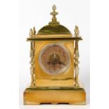 A FRENCH BRASS MANTLE CLOCK, THE PILLARED CASE WITH DOME TOP AND LOBED FINIAL, GONG STRIKING