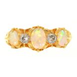 A THREE STONE OPAL AND DIAMOND RING IN 18CT GOLD, BIRMINGHAM 1913, THE CABOCHON OPALS APPROX 0.45CT,