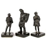 ONE AND A SIMILAR PAIR OF CONTINENTAL PATINATED SPELTER MINIATURE STATUETTES OF PEASANTS ON SLATE