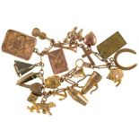 A GOLD CHARM BRACELET MARKED 9CT, WITH TWENTY GOLD CHARMS, THE MAJORITY MARKED 9CT, SEVERAL