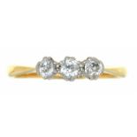 A THREE STONE DIAMOND RING IN GOLD, MARKED 18CT AND PLAT, THE OLD CUT DIAMONDS APPROX 0.3 CT, 2.