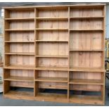 A PINE SHELVING UNIT, 200CM H; 230 X 31CM