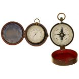 A VICTORIAN GILT BRASS POCKET BAROMETER, 4.5CM D, MAROON MOROCCO CASE, LATE 19TH C AND A GUNMETAL