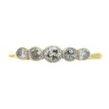 AN EDWARDIAN FIVE STONE DIAMOND RING IN GOLD, MARKED 18CT AND PLAT, THE OLD CUT DIAMONDS APPROX 0.26