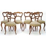 A SET OF SIX VICTORIAN CARVED ROSEWOOD DINING CHAIRS