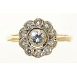 A DIAMOND CLUSTER RING IN GOLD MARKED 375, THE BRILLIANT CUT DIAMONDS APPROX 0.73 CT, 2.5G, SIZE