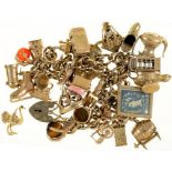 A 9CT GOLD CHARM BRACELET WITH 9CT GOLD CHARMS, 167.5G++WEAR CONSISTENT WITH AGE`