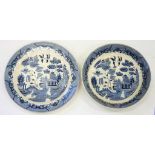 A BLUE PRINTED EARTHENWARE WILLOW PATTERN DISH AND BOWL, DISH 41CM D, 20TH C