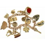 A 9CT GOLD CHARM BRACELET WITH 9CT GOLD CHARMS, 39G++LIGHT WEAR CONSISTENT WITH AGE