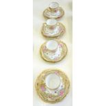 A SET OF FOUR NORITAKE COFFEE CUPS, SAUCERS AND PLATES, DECORATED WITH ROSES ON A PALE GREEN BAND