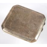 A GEORGE V SILVER CIGARETTE CASE, 9.5CM L, BIRMINGHAM 1925, EOZS AND A WORLD WAR TWO SHRAPNEL-