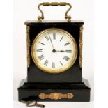 A FRENCH EBONISED CARRIAGE TIMEPIECE WITH ASSOCIATED BRASS HANDLE, ENAMELLED DIAL AND BRASS