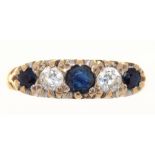 A THREE STONE SAPPHIRE RING IN 9CT GOLD, 2.5G, SIZE L++LIGHT SCRATCHES AND WEAR CONSISTENT WITH AGE