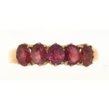 A RHODOLITE GARNET FIVE STONE RING IN 9CT GOLD, 1G, SIZE N++LIGHT SCRATCHES AND WEAR CONSISTENT WITH