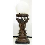 AN ART NOUVEAU STYLE FIGURAL LAMP OF NYMPHS HOLDING A FROSTED GLASS GLOBE SHADE, 88CM H