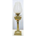 AN EDWARD VII REEDED BRASS COLUMNAR OIL LAMP, WITH MATCHING FOUNT AND BURNER, LOBED AND TAPERED