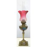 AN EDWARD VII CAST BRASS OIL LAMP OF UNUSUALLY SMALL PROPORTIONS WITH HEMISPHERICAL FOUNT AND
