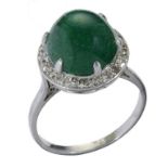 A CABOCHON EMERALD AND DIAMOND CLUSTER RING in platinum coloured metal, 6.7g, size N++The emerald