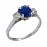 A SAPPHIRE AND DIAMOND RING the oval sapphire approx 4 x 4.5mm, in platinum, 3.2g, size M++Under