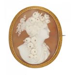 A CAMEO BROOCH, LATE 19TH C the oval shell carved with the head of a bacchante mounted in gold