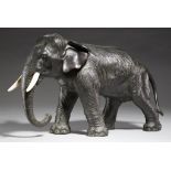 A JAPANESE BRONZE SCULPTURE OF AN ELEPHANT, MEIJI PERIOD ivory tusks, rich even dark patina, 24.
