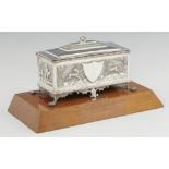 AN INDIAN SILVER CASKET, EARLY 20TH C the stepped rectangular lid with elephant knop, the sides with
