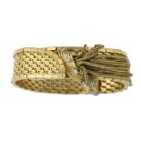 A FRENCH DIAMOND BRACELET in the form of a gold strap, with tassel 'knot', 1.5cm w, control mark and