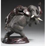 A JAPANESE BRONZE SCULPTURE OF AN ELEPHANT ATTACKED BY A TIGER, MEIJI PERIOD with ivory tusks,