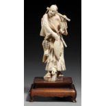 A JAPANESE IVORY OKIMONO OF A SAMURAI, MEIJI PERIOD 18cm h, affixed hardwood base ++A little dusty