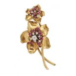 CARTIER. A RUBY, DIAMOND AND GOLD FLOWER BROOCH, MID 20TH C 7cm, signed Cartier London and stamped