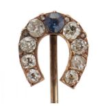 A VICTORIAN GOLD STICKPIN, C1900 with sapphire and diamond horseshoe terminal, terminal 1.3cm,