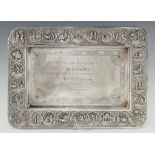 A FINE INDIAN SILVER REPOUSSÉ SWAMI STYLE TEA TRAY, LATE 19TH/EARLY 20TH C with engraved border