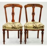 A PAIR OF VICTORIAN CARVED MAHOGANY DINING CHAIRS